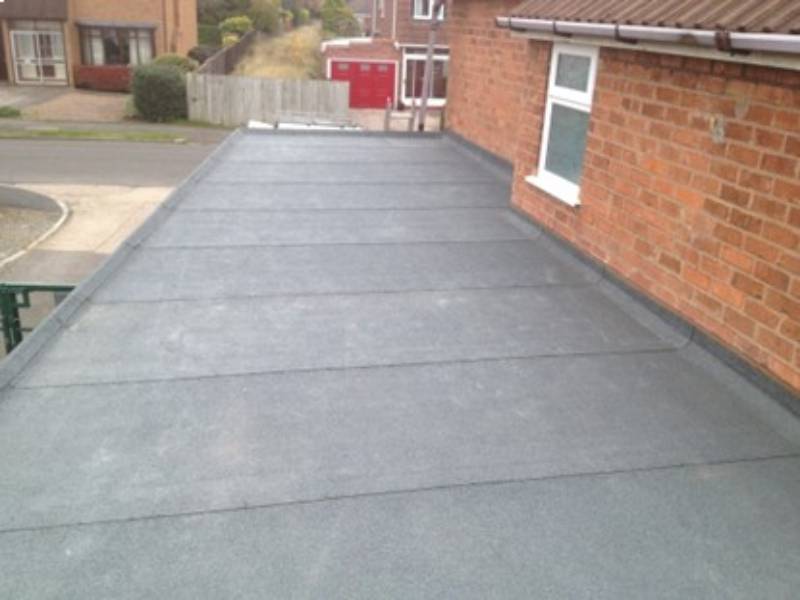 Flat roof over a single storey extension finished in mineral capsheet