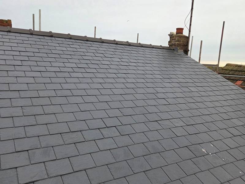 Completed natural slate roof laid by ABM Roofing