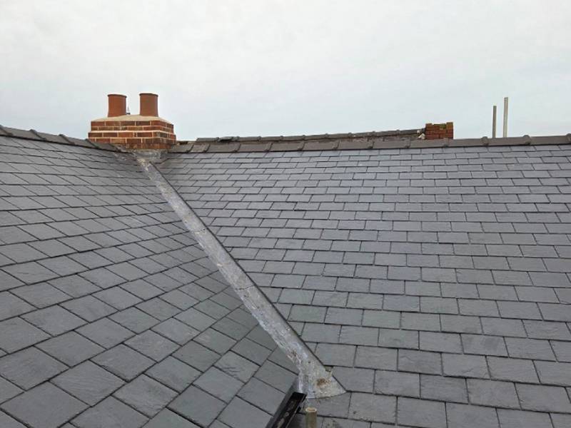 Slate roof with a new milled lead valley between two pitches